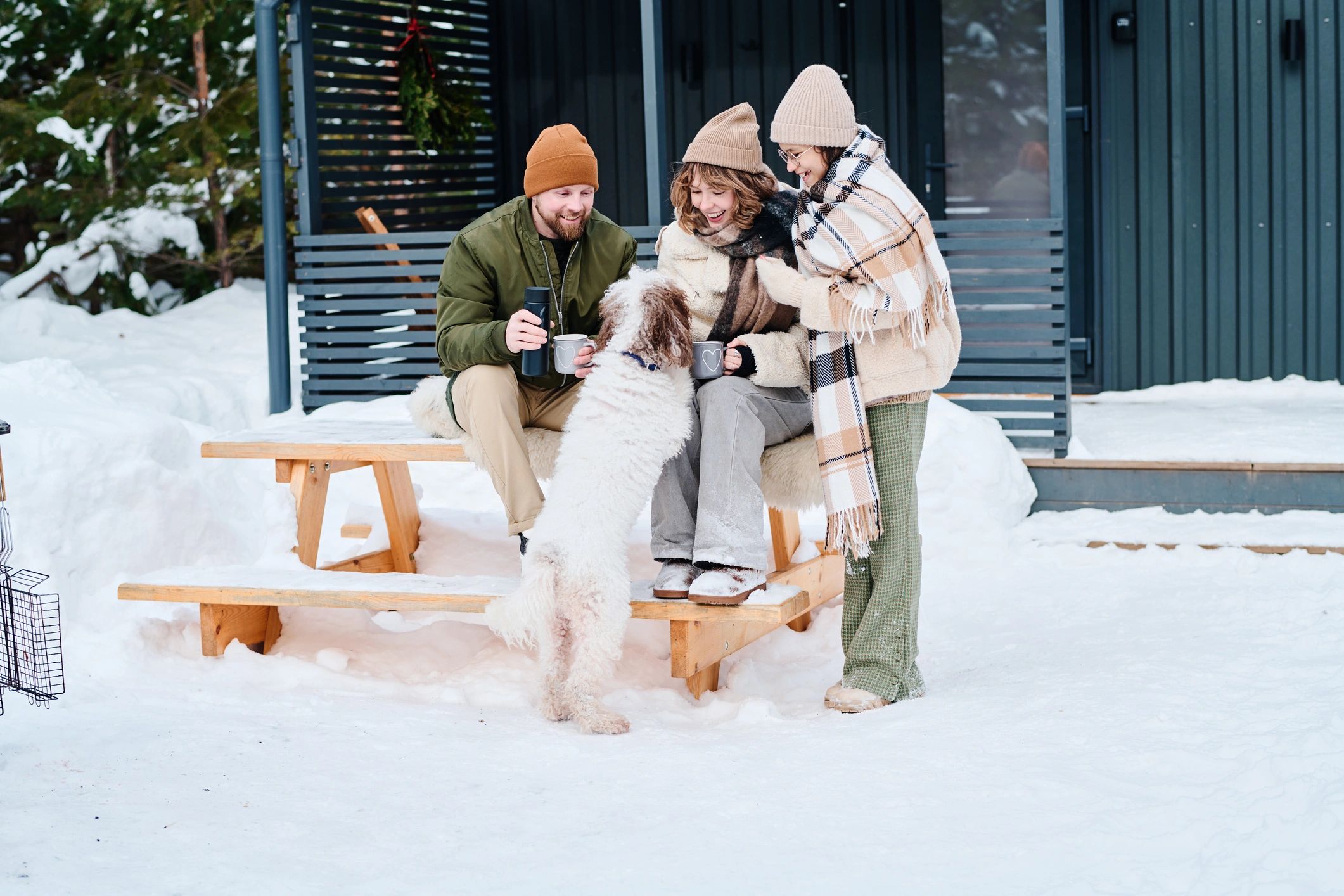 Parents and child spending time with their dog outdoors